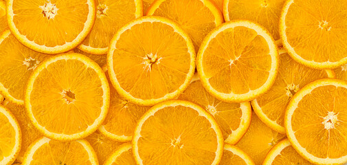 Bright orange circles are densely packed, filling the frame with a rich orange color.