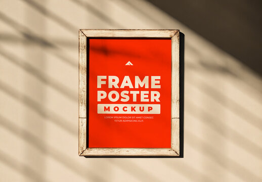 Vertical Frame Poster Mockup on a Wall with Sunlight and Minimal Shadow