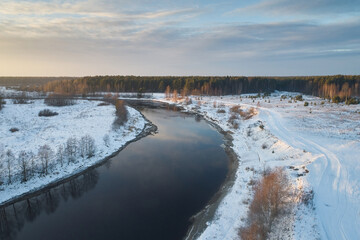 Aerial view of a river with water in the winter evening