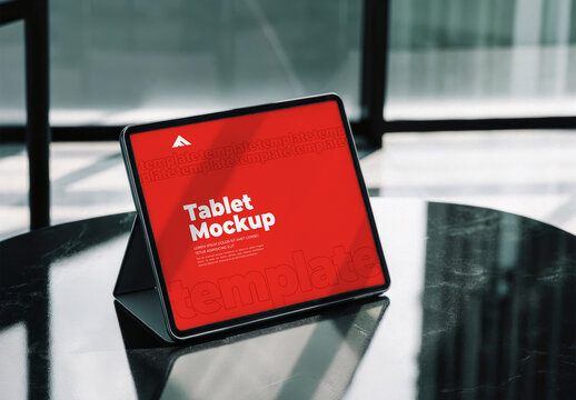 Angled Tablet Screen Mockup on a Reflective Surface for App Presentation