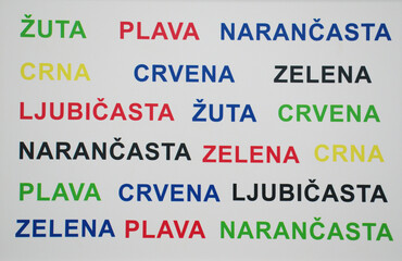 Stroop effect in Croatian, featuring color names printed in mismatched ink colors. This visual illustrates cognitive interference between reading and color recognition, a key concept in psychology.