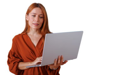 Redhead woman holding laptop and typing, using technology for work, business, and communication, transparent background