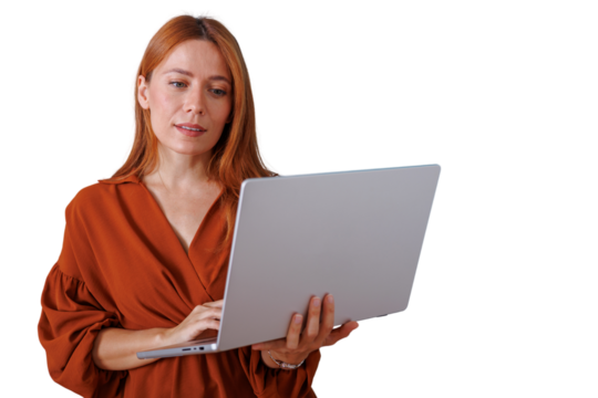 Redhead woman holding laptop and typing, using technology for work, business, and communication, transparent background