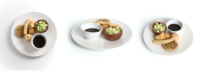 Close up of pempek, traditional indonesian food with cucumber and spicy sauce.