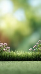 Obraz premium Lush green grass and vibrant pink flowers flourishing in a spring garden, set against a softly blurred background, create a lively and natural atmosphere perfect for outdoor beauty