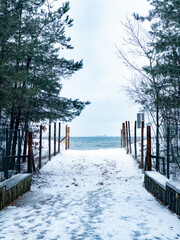 Snowy Path to the Sea on a Cold Day. Winter Beach.