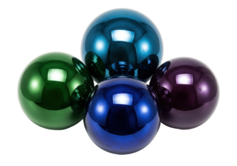 Isolated vibrant arrangement of shiny glass Christmas ornaments or baubles in four colors