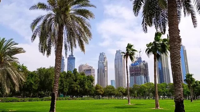 Al Safa public park and view of the skyscrapers and construction sites at Business Bay, Dubai