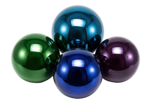 Isolated vibrant arrangement of shiny glass Christmas ornaments or baubles in four colors