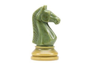 Isolated jade knight chess piece, carved from green stone, resting on a beige pedestal base © Natasha