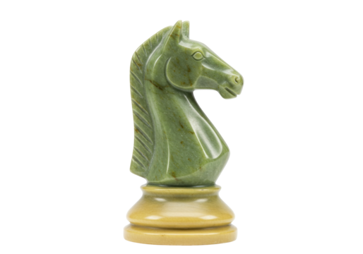 Isolated jade knight chess piece, carved from green stone, resting on a beige pedestal base