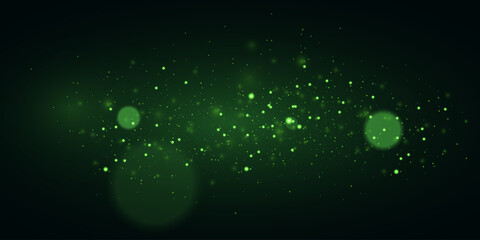Green glowing particles on dark background