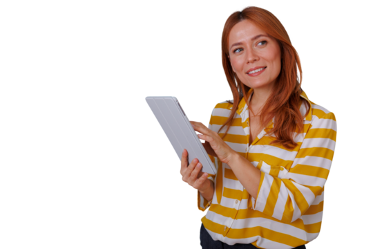 Redhead woman holding tablet looking away, smiling, using modern technology for work or education, transparent background
