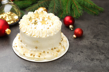 Delicious cake with Christmas decor on grey table, closeup. Space for text