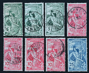 Close-up image of eight vintage Swiss postage stamps from the 1900 Jubilé de l’Union Universelle (Universal Postal Union Jubilee) series.