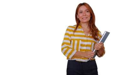 Young businesswoman with red hair, wearing a striped shirt, holding a laptop, smiling, ready for business on transparent background