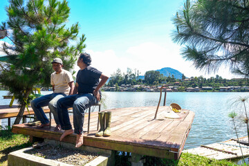 Hardworking Farmers Carefully Water Their Lush Cabbage Crops Under Hot Sun