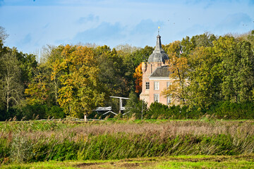 Castle in Autumn: Historic Dutch Estate Surrounded by Warm Fall Foliage and Wetlands