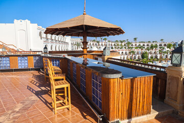 An empty bar counter on an outdoor terrace at a hotel in Egypt.