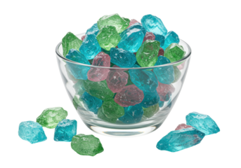 Isolated assorted hard rock candy drops in a glass bowl, colorful confectionery assortment