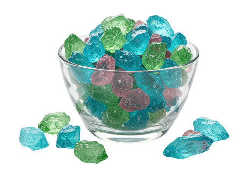Isolated assorted hard rock candy drops in a glass bowl, colorful confectionery assortment