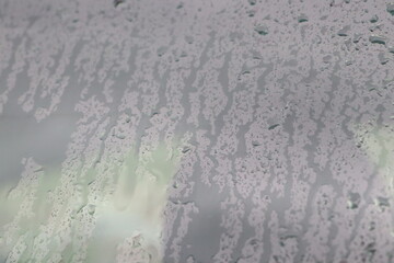 silent window scene with gentle rain details, soft rainfall on glass creates calm and dreamy