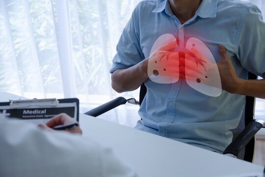 Lung Cancer. young man patient holding hands on chest suffering from lung disease meet doctor in hospital, tuberculosis disease, health care, heart attack, medical and health care technology concept