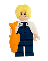 Obraz premium Dortmund - Deutschland 4. November 2025 - Lego Figur Sanji mit Fisch blickt böse der Serie One Piece - Studio Aufnahme