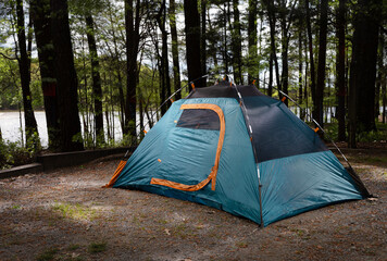 Lighted backpacking tent in a campsite