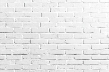 Obraz premium A clean textured white brick wall surface in an evenly lit neutral environment