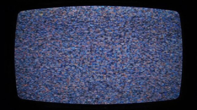 A classic television screen displaying static.  Rounded frame, dark surroundings.  Blue, orange, and white noise