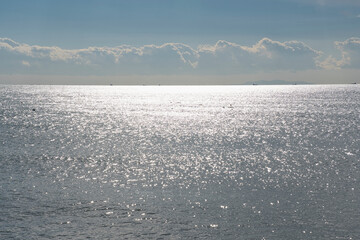 Sunlight shimmering across the calm sea