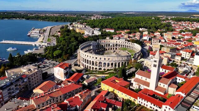 Cinematic Aerial View of Pula, Croatia &ndash; Ancient Roman Amphitheatre, Historic City and Adriatic Coastline from Drone