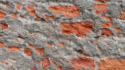 Rough Textured Gray Cement Wall With Exposed Red Bricks background