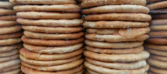 Stacked golden brown flatbreads with visible texture baked goods food