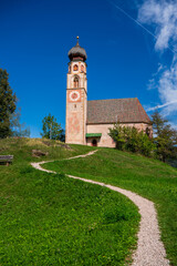 View of the St. Valentine Church in the small settlement of St. Valentine above Seis in South Tyrol, Italy.