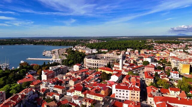 Cinematic Aerial View of Pula, Croatia &ndash; Ancient Roman Amphitheatre, Historic City and Adriatic Coastline from Drone