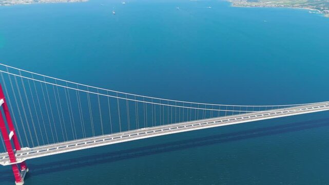 Lapseki, Turkey. Low aerial view of cars driving on the 1915 Canakkale Bridge over the deep blue Dardanelles strait. Aerial View