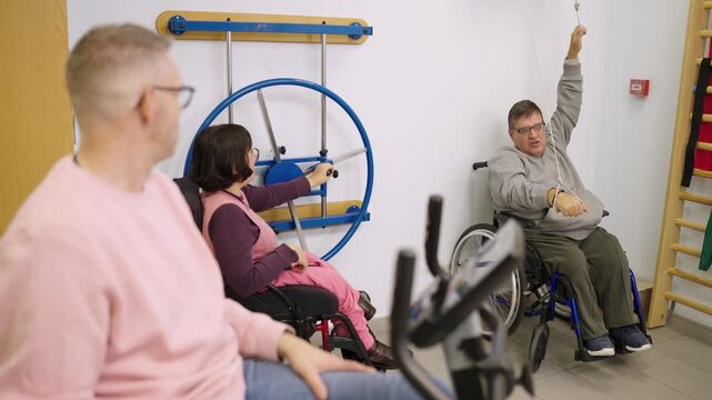 People with disabilities engaging in rehabilitation exercises at the gym