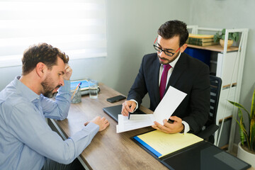 Stressed client getting legal advice from lawyer in office