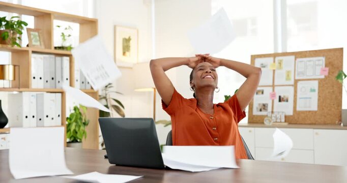 Relax, happy and black woman throw paperwork for project goals, achievement or success in career. Smile, laptop and African creative director with documents for completed publishing in workplace.