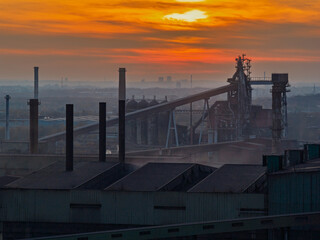 Aerial drone view of Industrial steel factory, iron works. Metallurgical plant. steelworks. Heavy industry in Europe, Poland, Dabrowa Gornicza. Air pollution from chimneys. Ecology and environmental