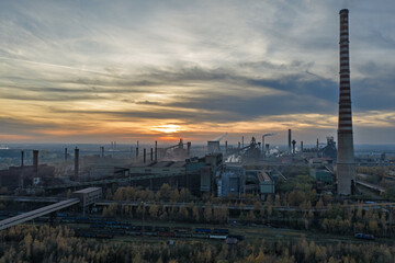 Aerial drone view of Industrial steel factory, iron works. Metallurgical plant. steelworks. Heavy industry in Europe, Poland, Dabrowa Gornicza. Air pollution from chimneys. Ecology and environmental