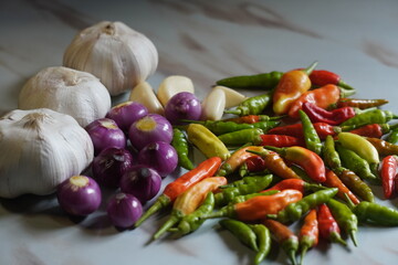 Fresh Raw Ingredients Garlic Shallots and Chili Peppers for Cooking.