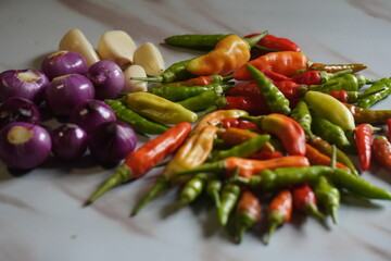 Fresh Raw Chili Peppers Shallots and Garlic Ingredients for Cooking.