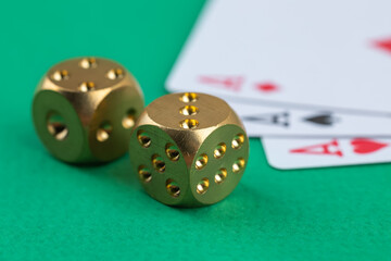Playing cards and dices. Gambling concept. Green background