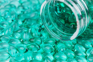 Blue capsules in the shell with liquid vitamin. Blue capsules with a dietary supplement for joints teeth and bones