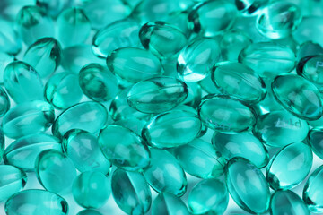 Blue capsules in the shell with liquid vitamin. Blue capsules with a dietary supplement for joints teeth and bones