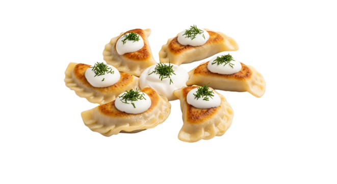 Delicious pierogi, dumplings with savory filling, are topped with dollops of sour cream and fresh dill for a delectable appetizer.