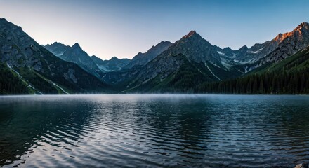 Serene panoramic vista of a mountain lake reflecting peaks under a dusky sky